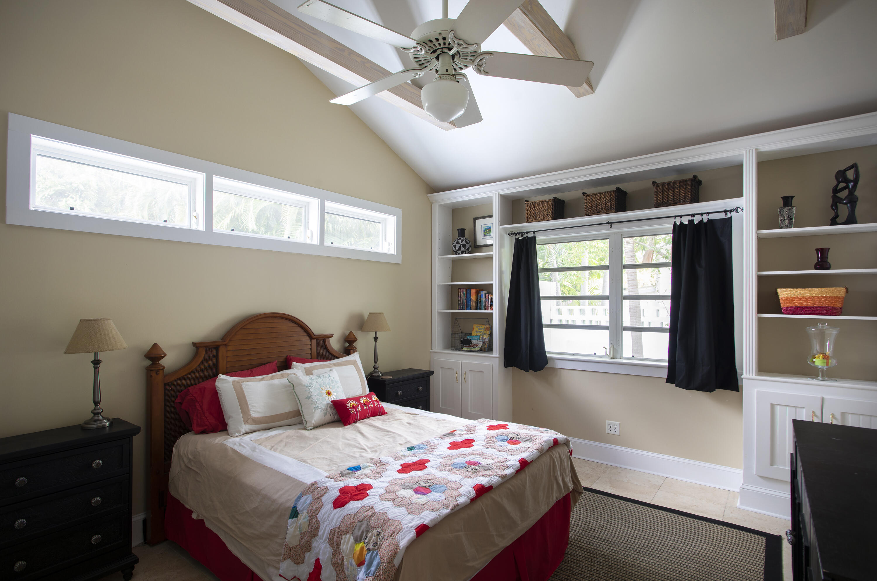 1506 South Street Key West, FL 33040 - Photo 6 of 27 a bedroom with a bed a dresser next to a window