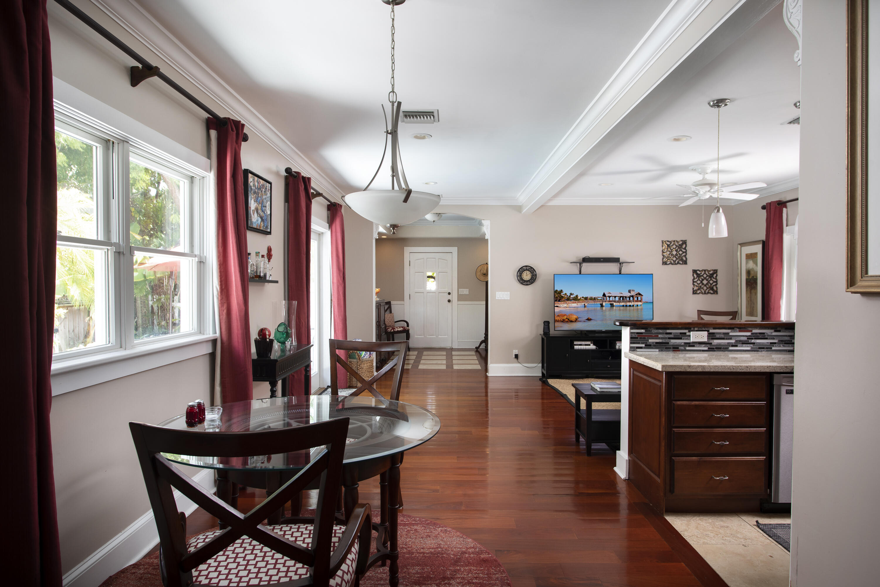 1506 South Street Key West, FL 33040 - Photo 8 of 27 a view of a dining room with furniture window and wooden floor