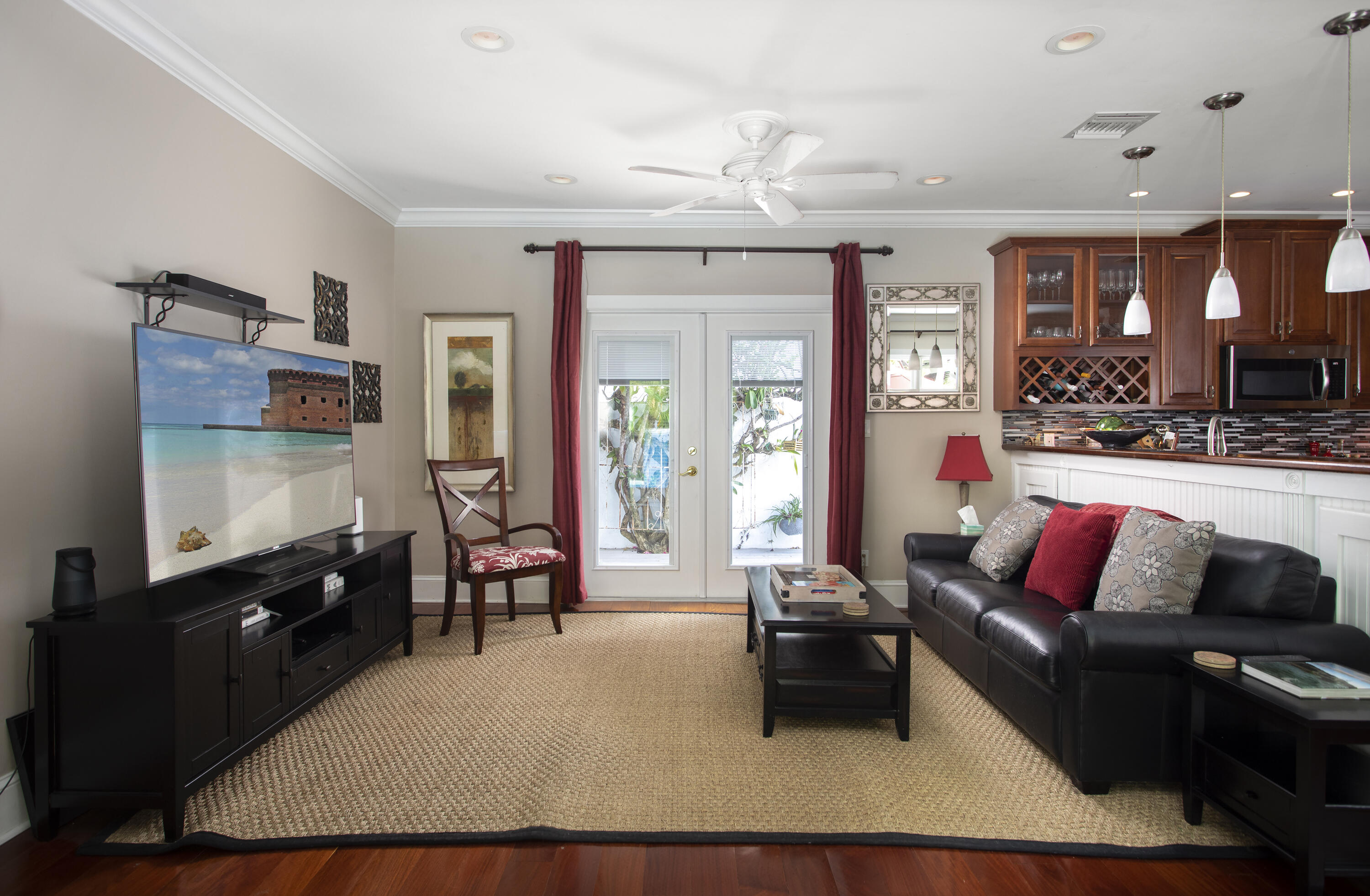 1506 South Street Key West, FL 33040 - Photo 9 of 27 a living room with furniture and a flat screen tv