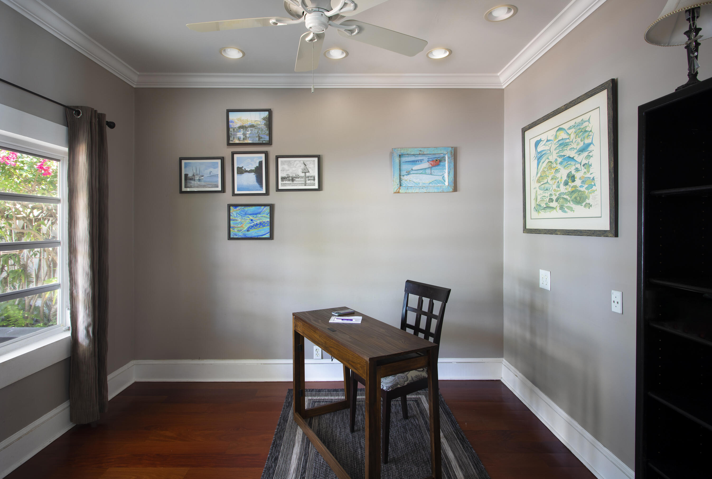1506 South Street Key West, FL 33040 - Photo 10 of 27 a view of a workspace with furniture and a window