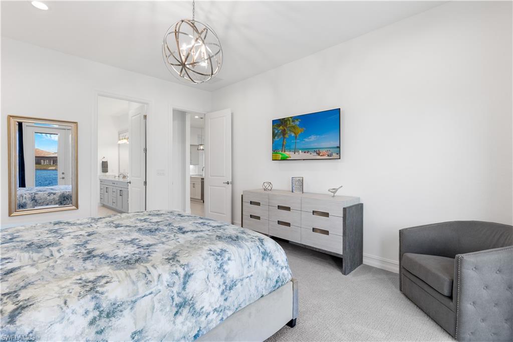 14265 Laguna Springs Lane Naples, FL 34114 - Photo 14 of 40 a bedroom with furniture and windows