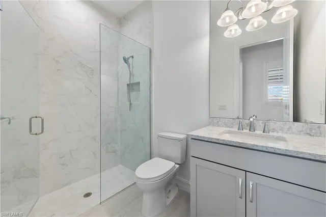 a bedroom with a bed and a table