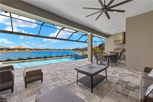 a view of an outdoor dining space with furniture and garden