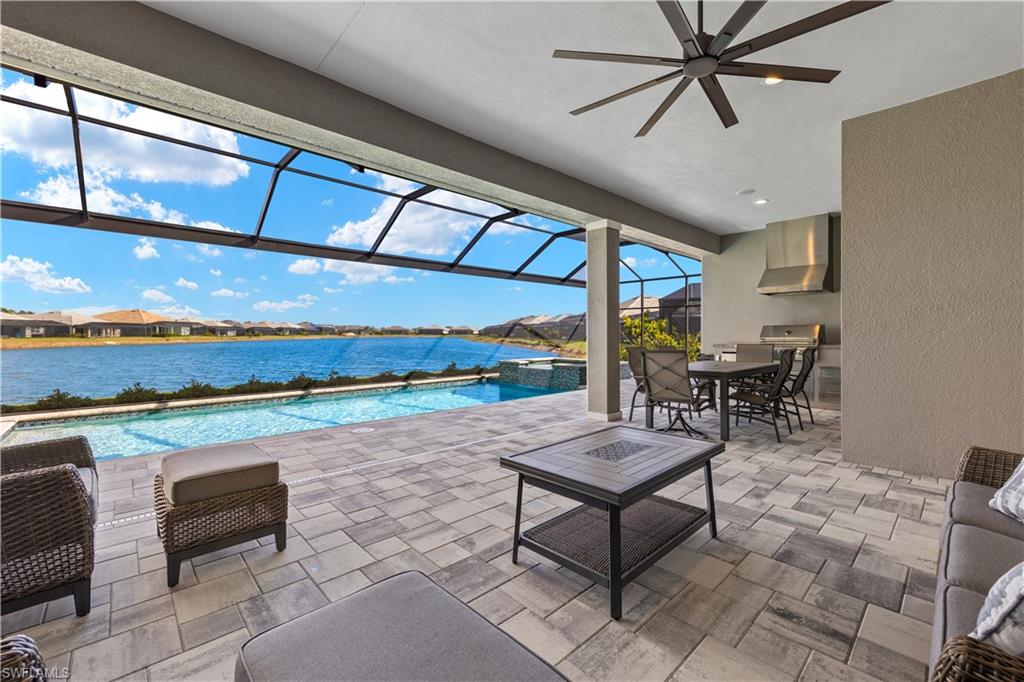 14265 Laguna Springs Lane Naples, FL 34114 - Photo 22 of 40 a living room with patio furniture