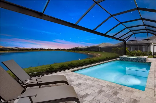 a view of swimming pool with outdoor seating