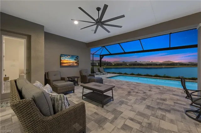 an aerial view of a house swimming pool and garden
