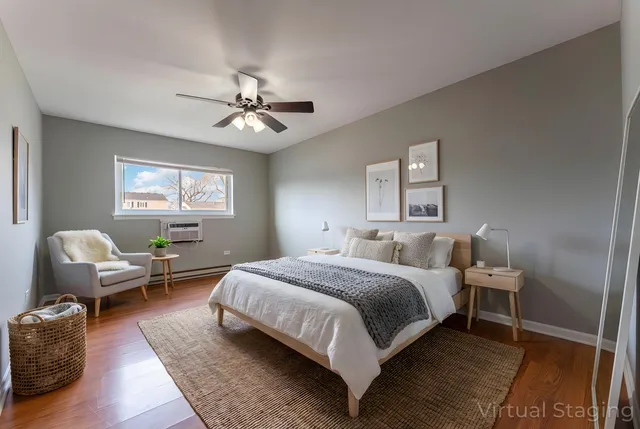 a bedroom with a bed couch and a window