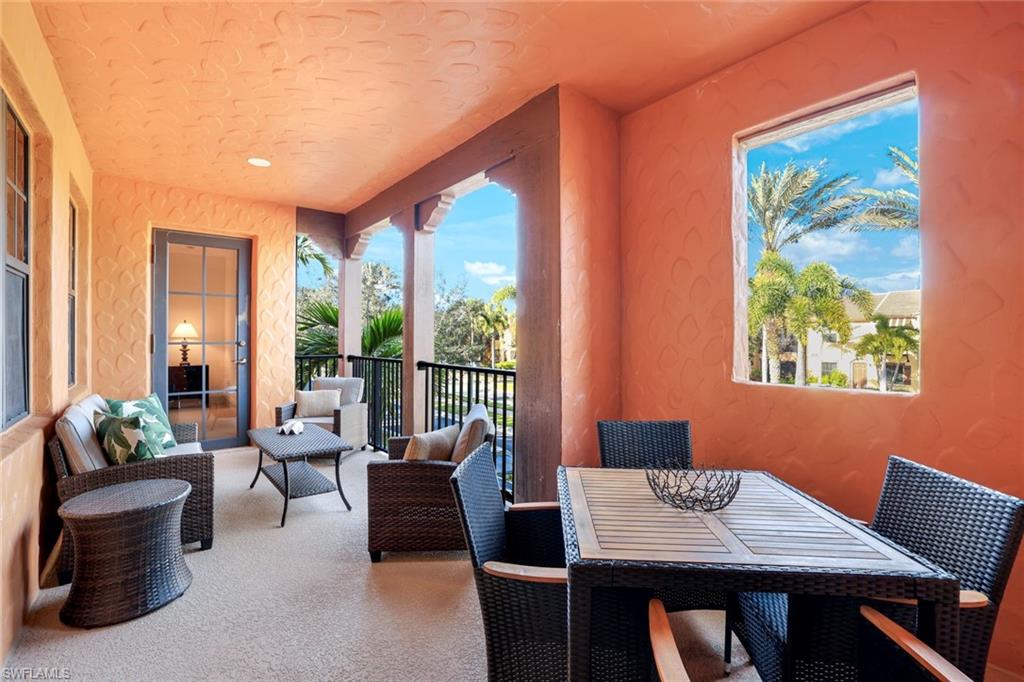 9072 Rialto Street, Unit 6302 Naples, FL 34113 - Photo 16 of 17 Balcony featuring an outdoor living / dining area