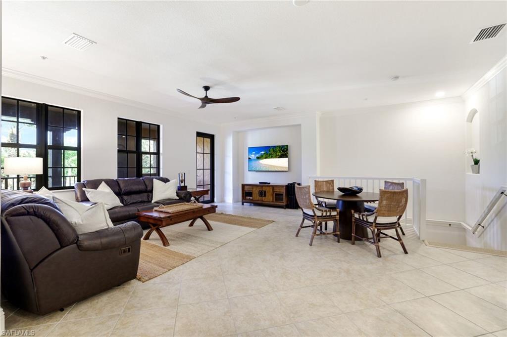 9072 Rialto Street, Unit 6302 Naples, FL 34113 - Photo 3 of 17 Living room with ceiling fan, ornamental molding, and light tile patterned floors