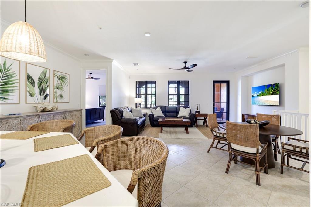 9072 Rialto Street, Unit 6302 Naples, FL 34113 - Photo 5 of 17 Dining space featuring ornamental molding, light tile patterned floors, and a ceiling fan