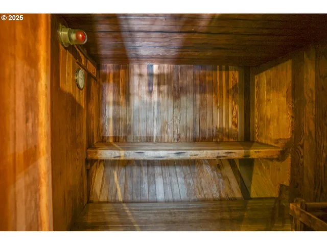 a living room with furniture and a book shelf