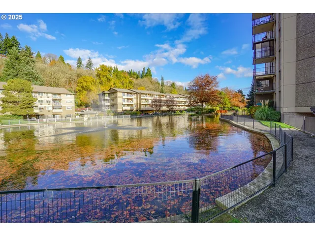 a view of a lake with a building in the background