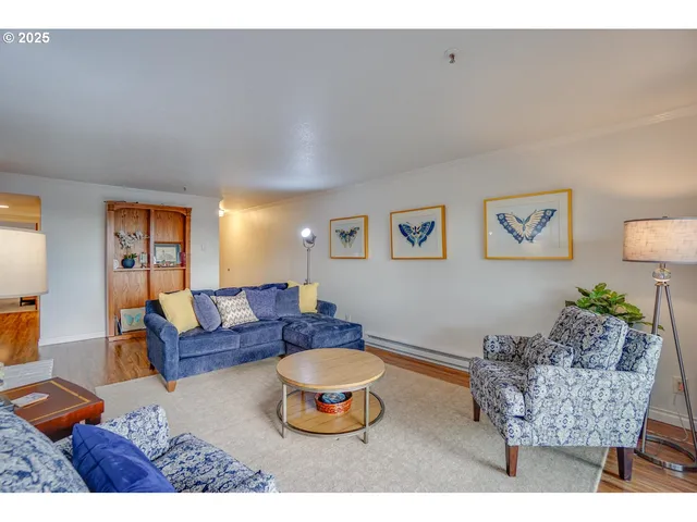 a living room with furniture and a table