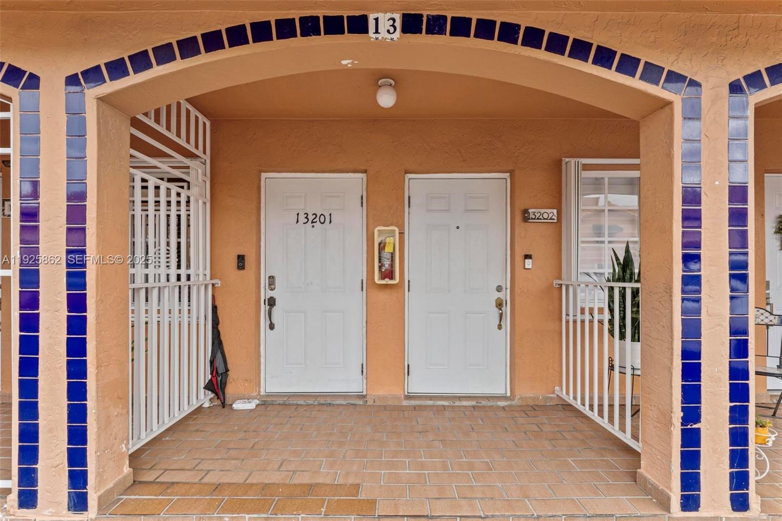 10101 West Okeechobee Road, Unit 13202 Hialeah Gardens, FL 33016 - Photo 13 of 30 a front view of a house with a door