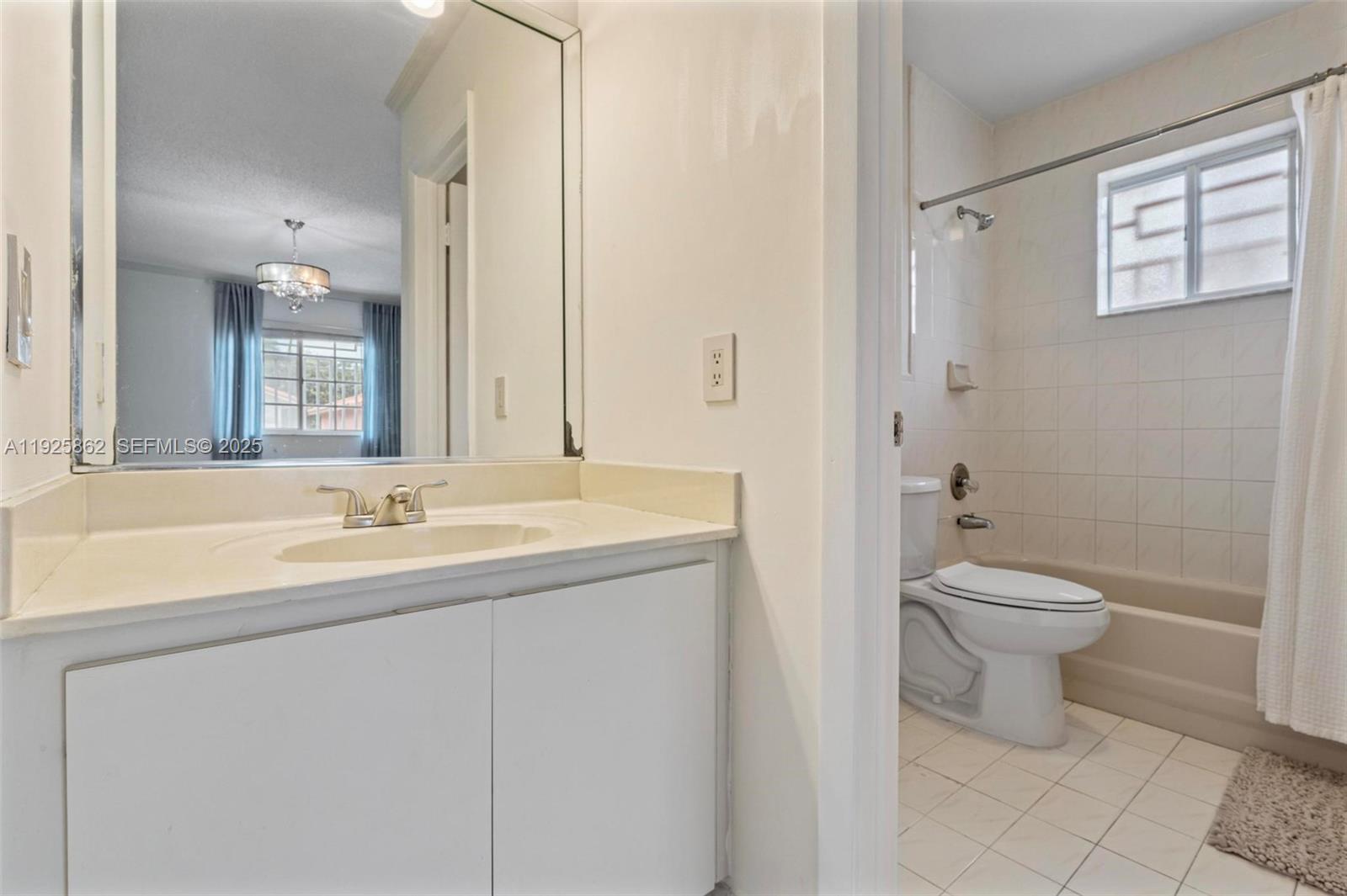 10101 West Okeechobee Road, Unit 13202 Hialeah Gardens, FL 33016 - Photo 28 of 30 a bathroom with a sink a toilet and shower