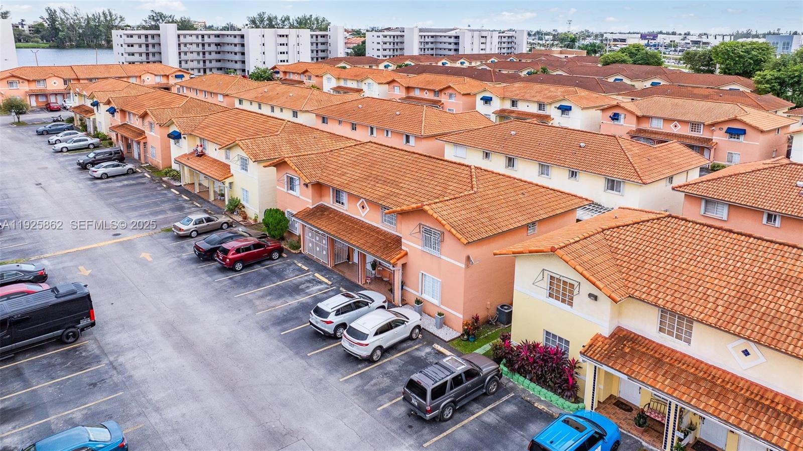 10101 West Okeechobee Road, Unit 13202 Hialeah Gardens, FL 33016 - Photo 4 of 30 an aerial view of a houses with outdoor space