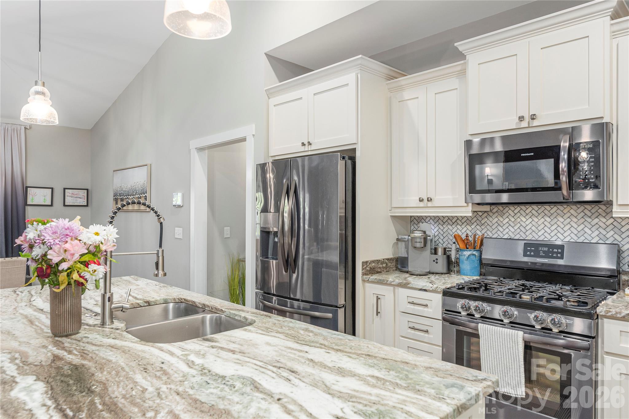 348 Olivet Lane Fletcher, NC 28732 - Photo 14 of 39 a kitchen with stainless steel appliances granite countertop a sink stove and refrigerator