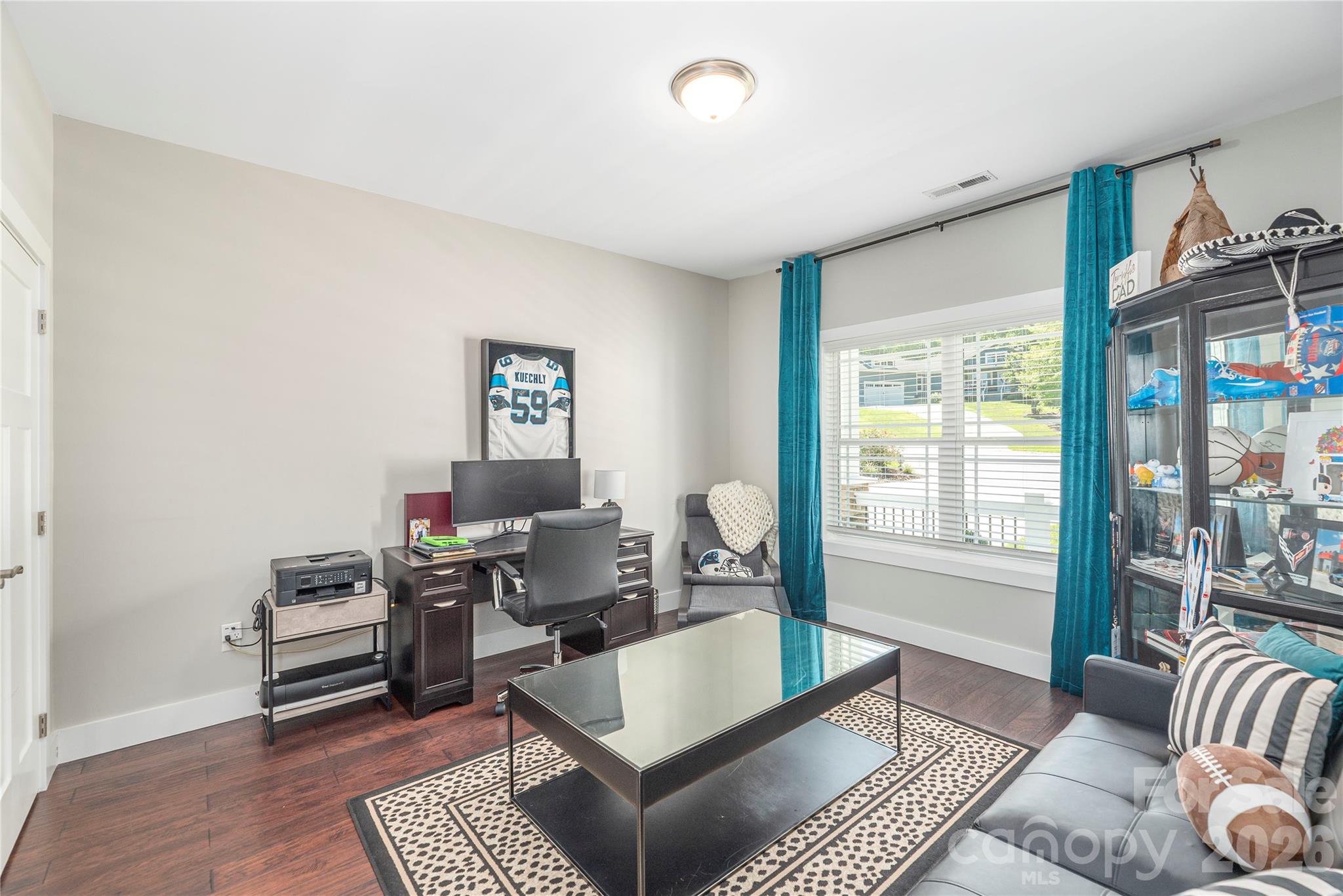 348 Olivet Lane Fletcher, NC 28732 - Photo 22 of 39 a living room with furniture and a window