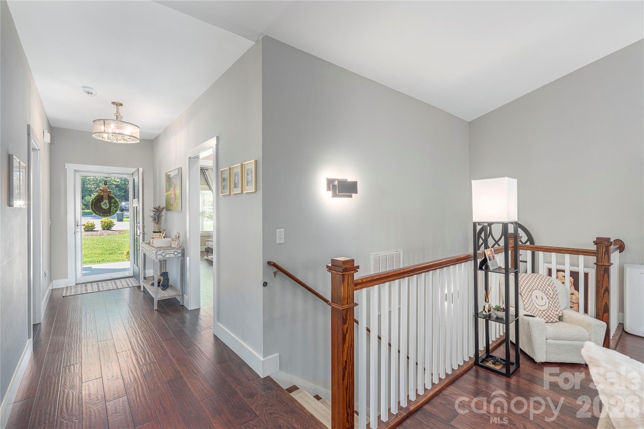 348 Olivet Lane Fletcher, NC 28732 - Photo 25 of 39 a view of hallway with wooden floor and stairs