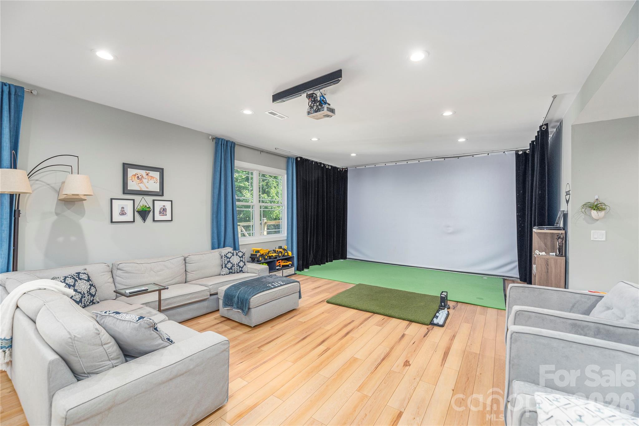 348 Olivet Lane Fletcher, NC 28732 - Photo 26 of 39 a living room with furniture and a wooden floor