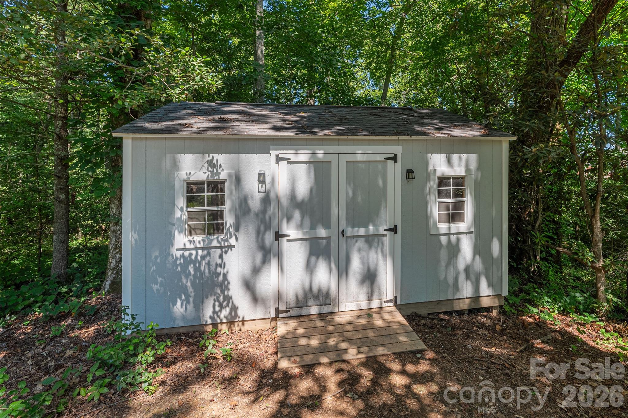 348 Olivet Lane Fletcher, NC 28732 - Photo 38 of 39 a view of a backyard with large trees