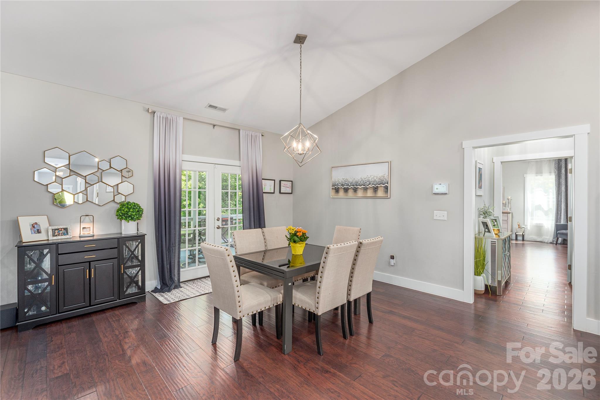 348 Olivet Lane Fletcher, NC 28732 - Photo 9 of 39 a view of a dining room with furniture window and wooden floor