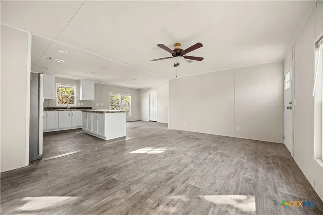 a view of a kitchen with a sink and cabinet area