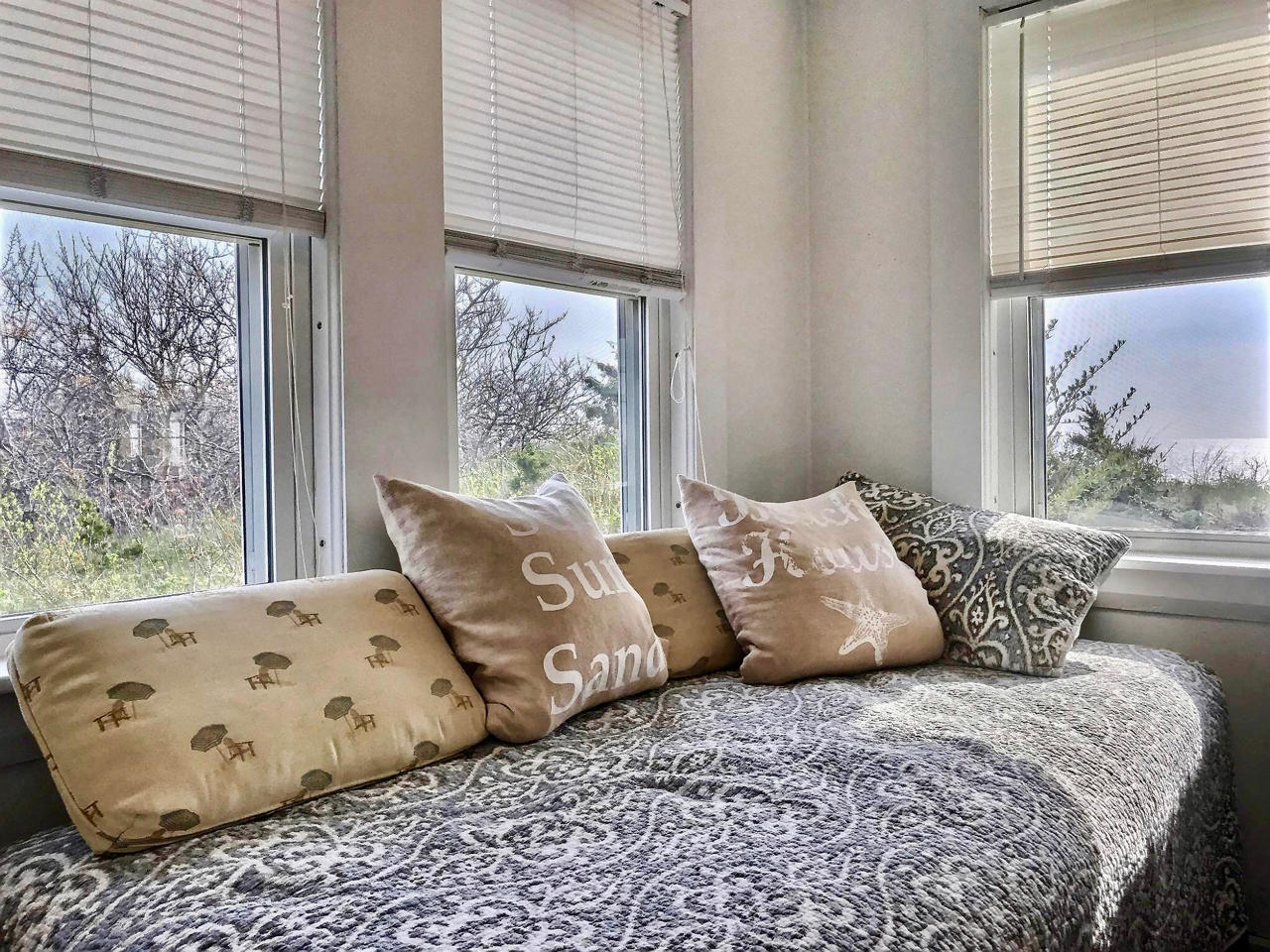 345 Shurtleff Road Eastham, MA 02642 - Photo 11 of 23 a bed sitting in a bedroom next to a window