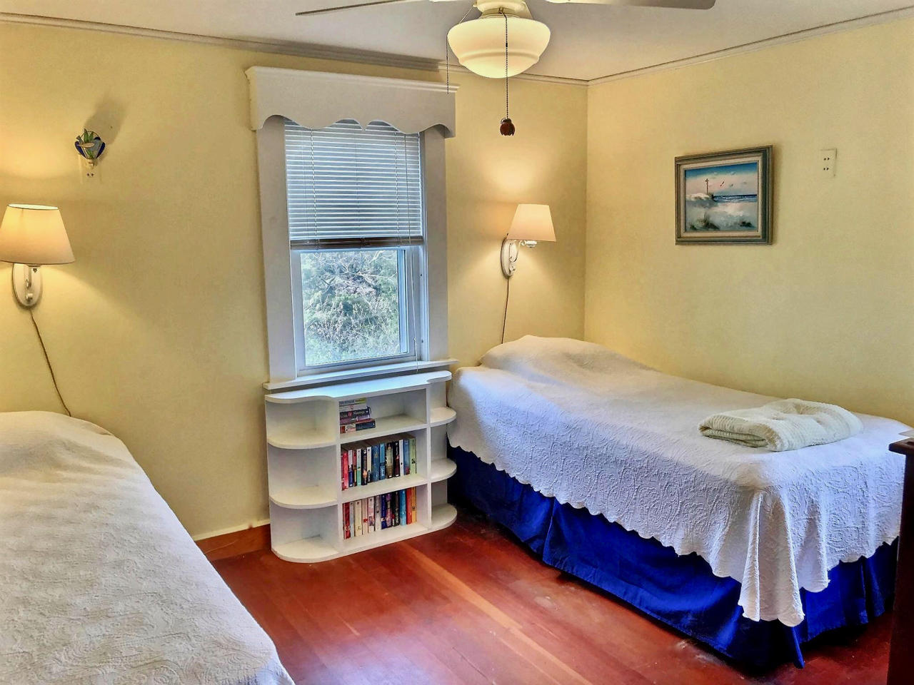 345 Shurtleff Road Eastham, MA 02642 - Photo 14 of 23 a bedroom with a bed and lamp