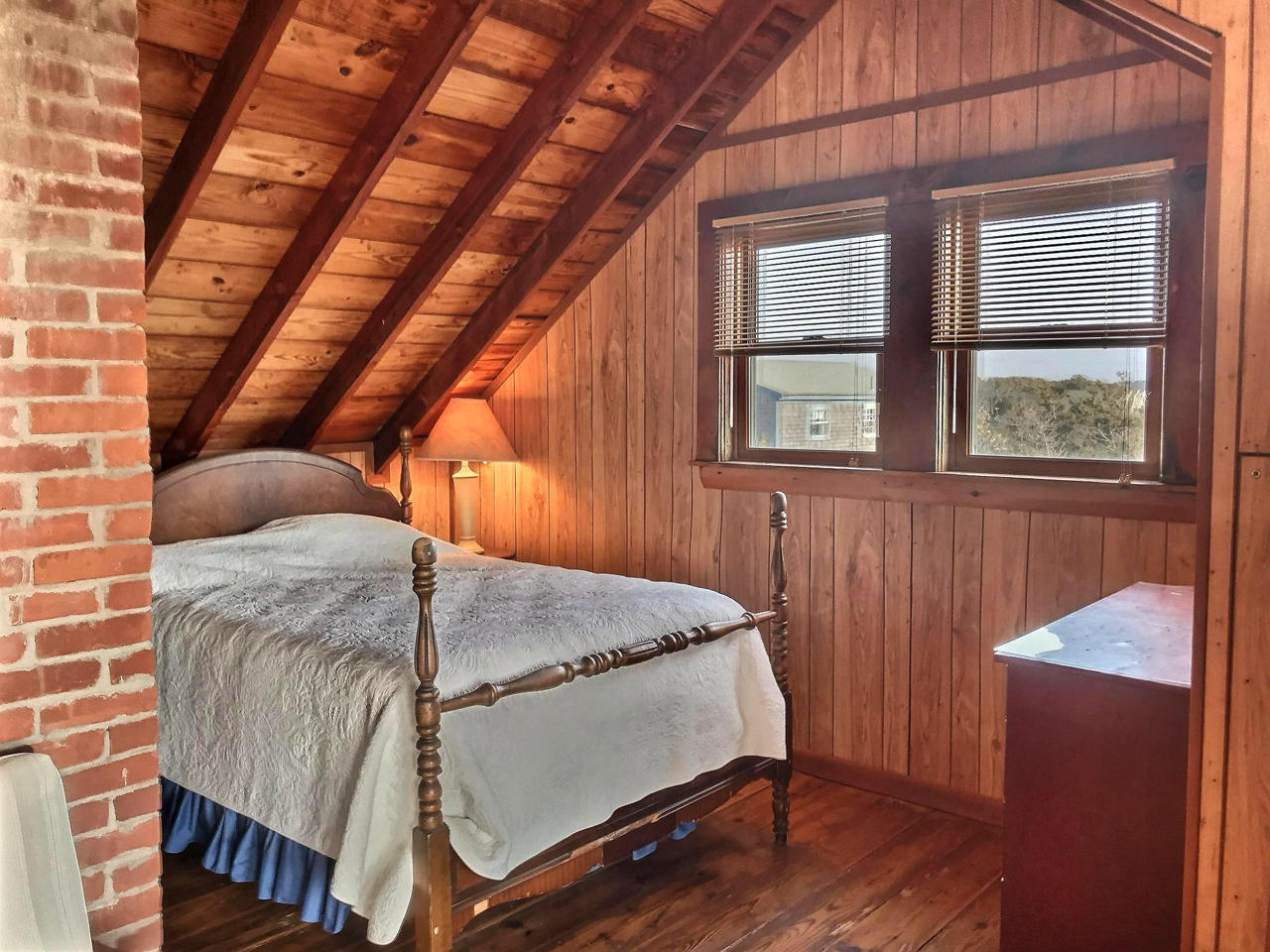 345 Shurtleff Road Eastham, MA 02642 - Photo 17 of 23 a bed sitting in a bedroom next to a window