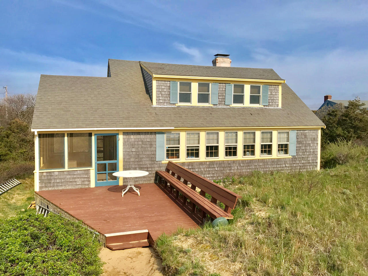 345 Shurtleff Road Eastham, MA 02642 - Photo 2 of 23 a front view of a house with a yard