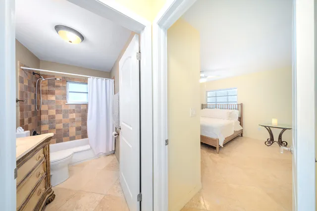 a view of a lake with couches in patio