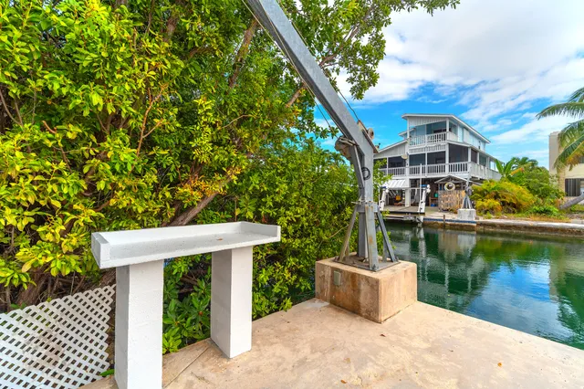 an aerial view of a house with a swimming pool