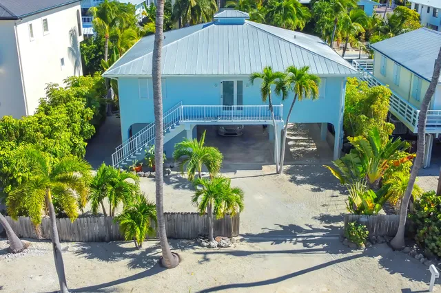 a front view of house with yard and seating space