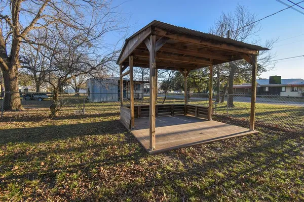 a view of a backyard with wooden floor