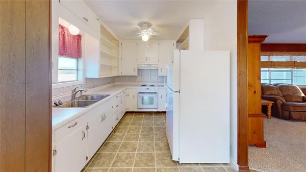 a bathroom with a bathtub sink and mirror