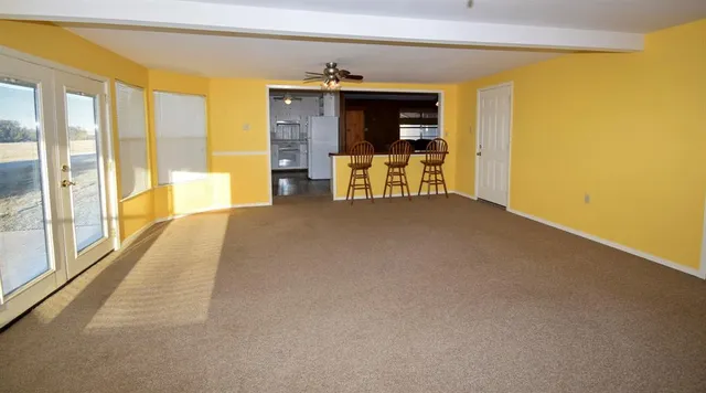 a view of an empty room with a fireplace