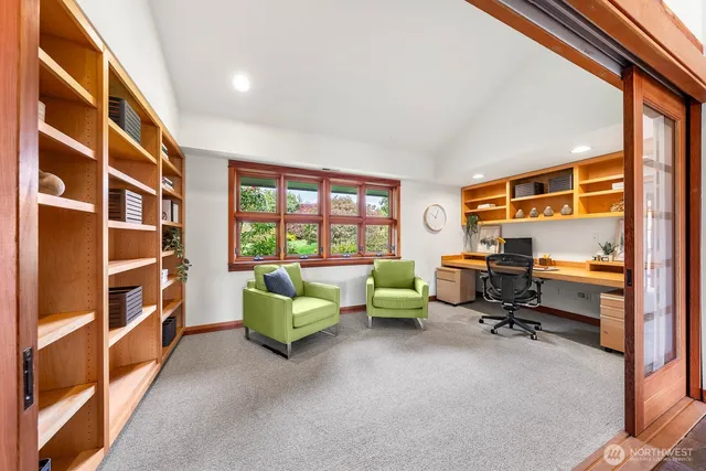 a workspace with furniture and a window