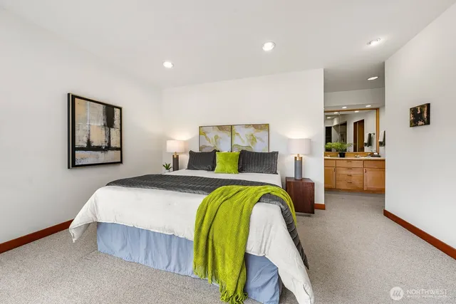 a bedroom with a bed and a couch