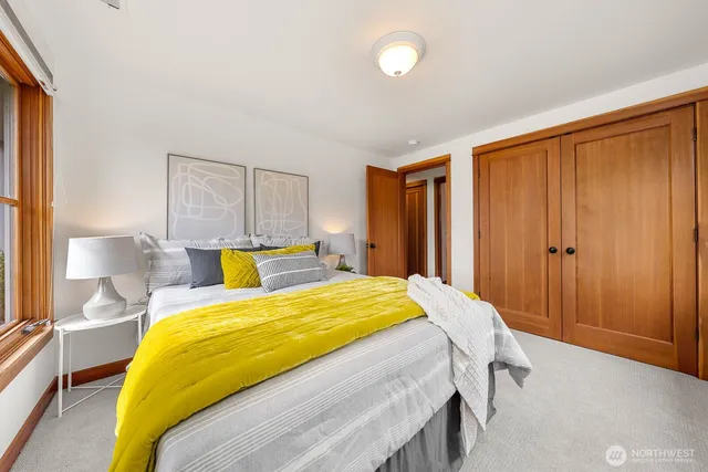 a bedroom with a bed and window