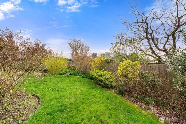 an aerial view of a house with garden space and street view