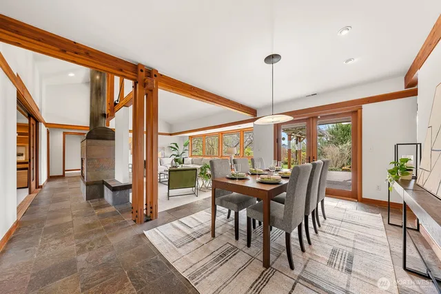 a dining room with furniture and window