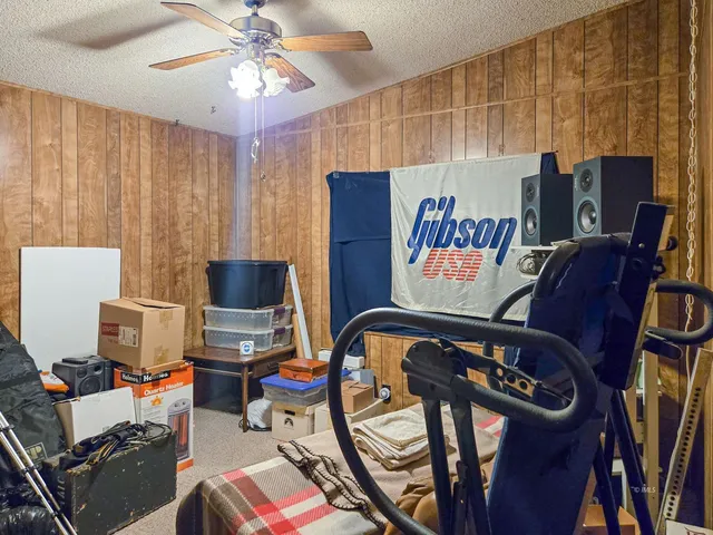 a view of a livingroom with workspace and a window
