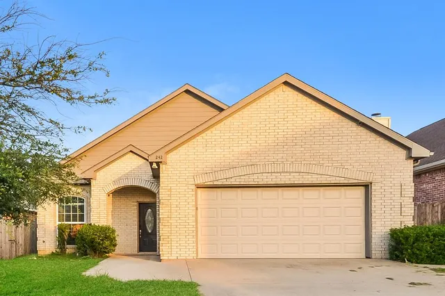 a view of front of house with garage