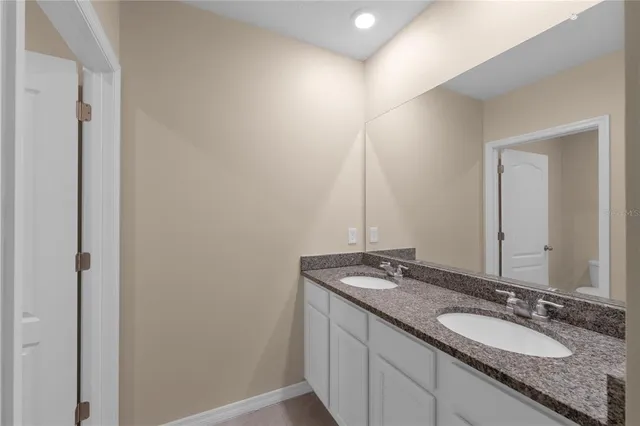 a bathroom with a bathtub toilet and sink