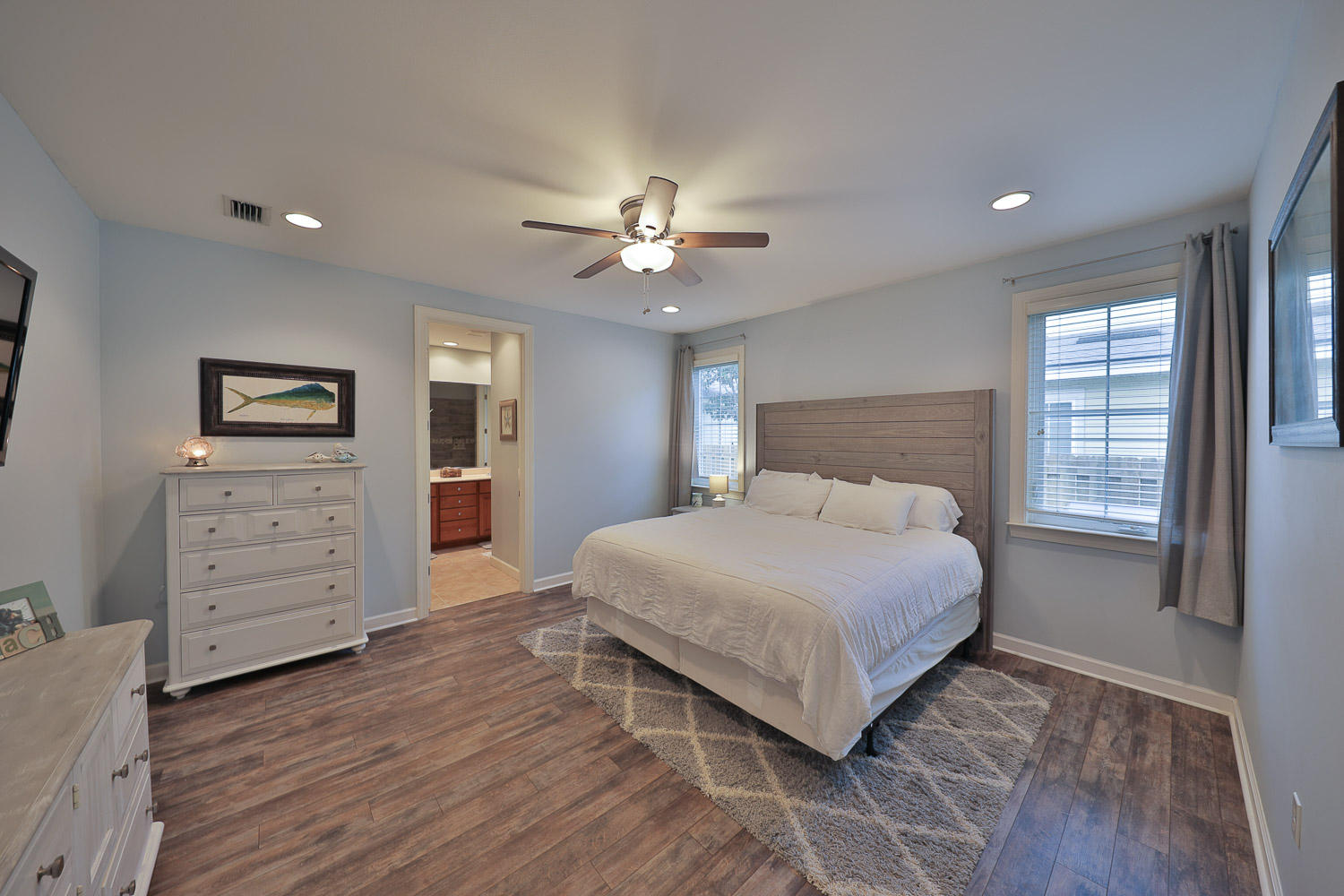 222 South Zander Way Santa Rosa Beach, FL 32459 - Photo 12 of 31 a bedroom with a large bed and a chandelier