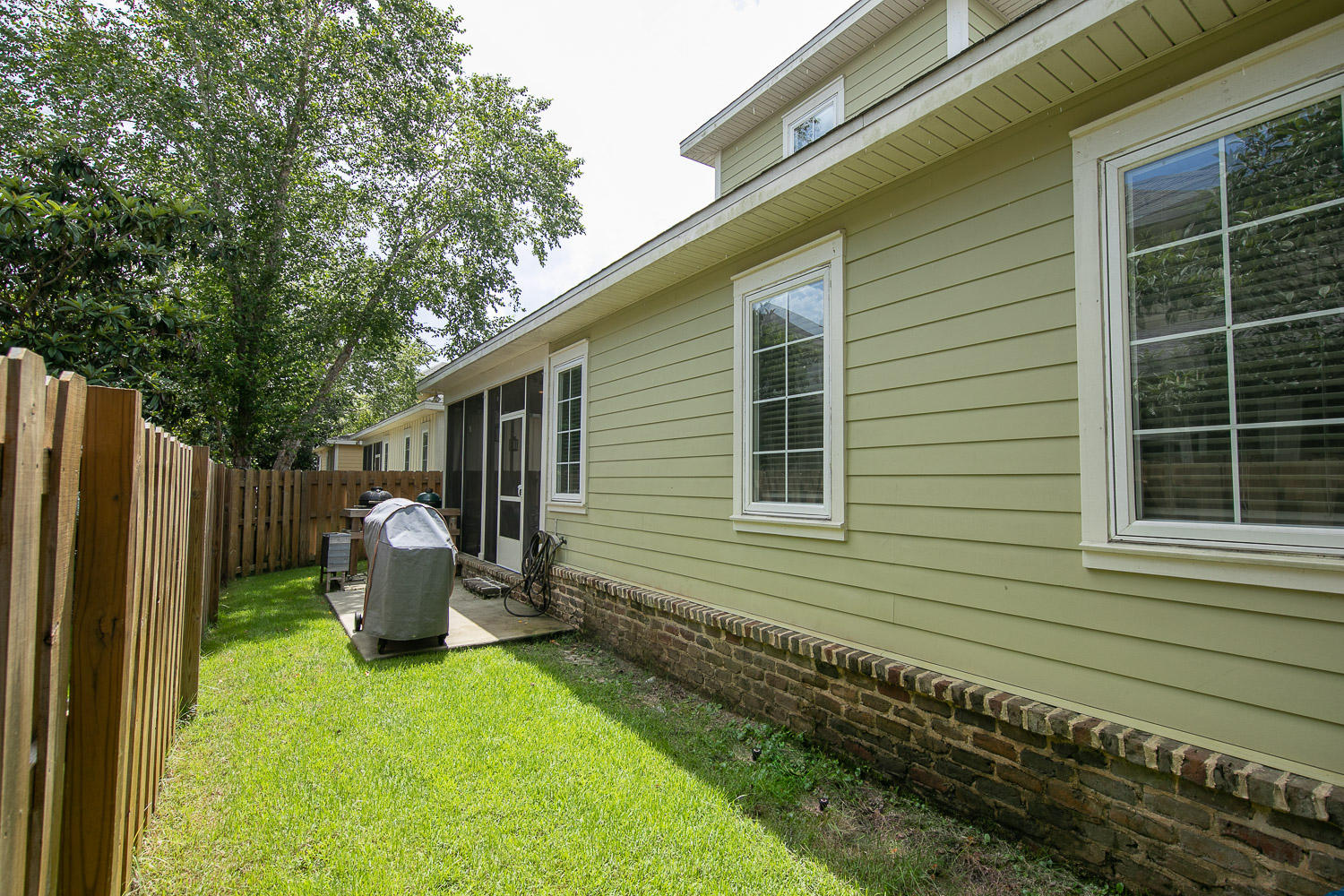 222 South Zander Way Santa Rosa Beach, FL 32459 - Photo 21 of 31 a backyard of a house with seating space