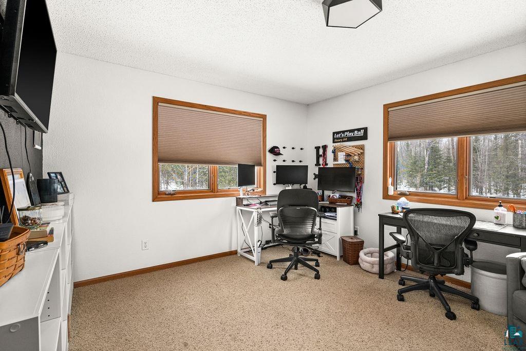 2783 Lauren Road Duluth, MN 55804 - Photo 32 of 47 Office area featuring light colored carpet, a textured ceiling, and healthy amount of natural light