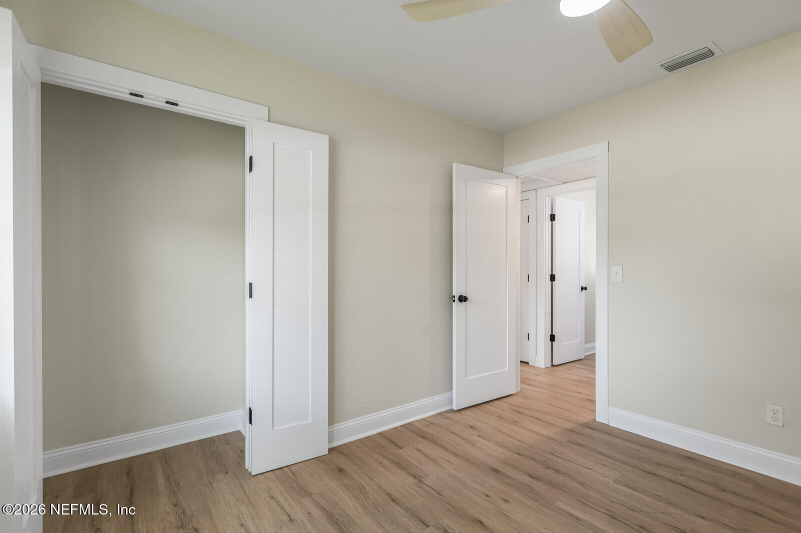 2614 Leonid Road Jacksonville, FL 32218 - Photo 15 of 24 a view of an empty room with wooden floor