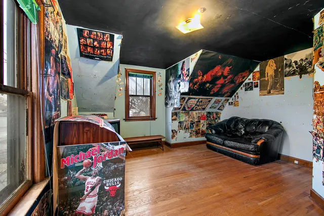 a bedroom with furniture and a flat screen tv